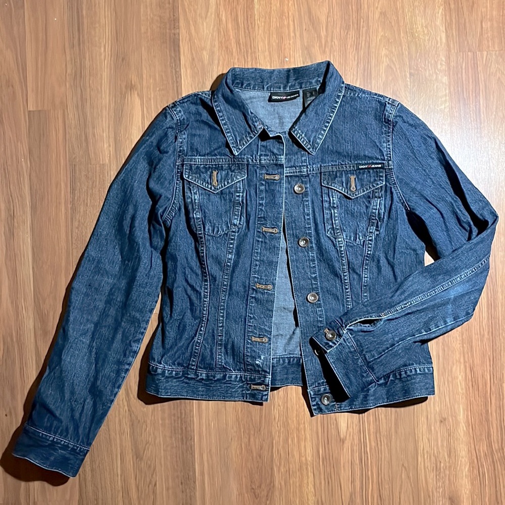 Used DKNY dark denim jacket, size Large. Some imperfections in the jacket.